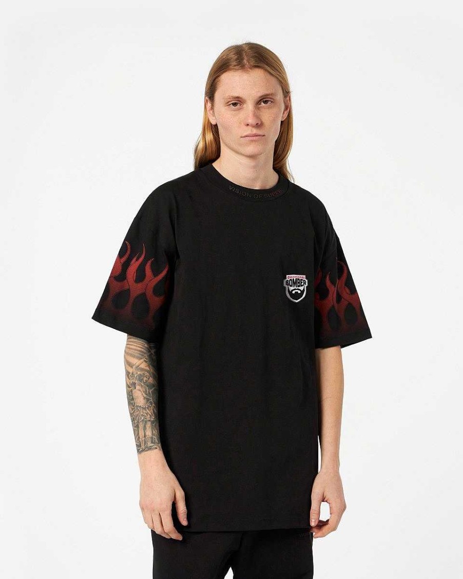 Men Vision of Super T-Shirts | Black T-Shirt With Red Tribal Flames And Chiamarsi Bomber Logo